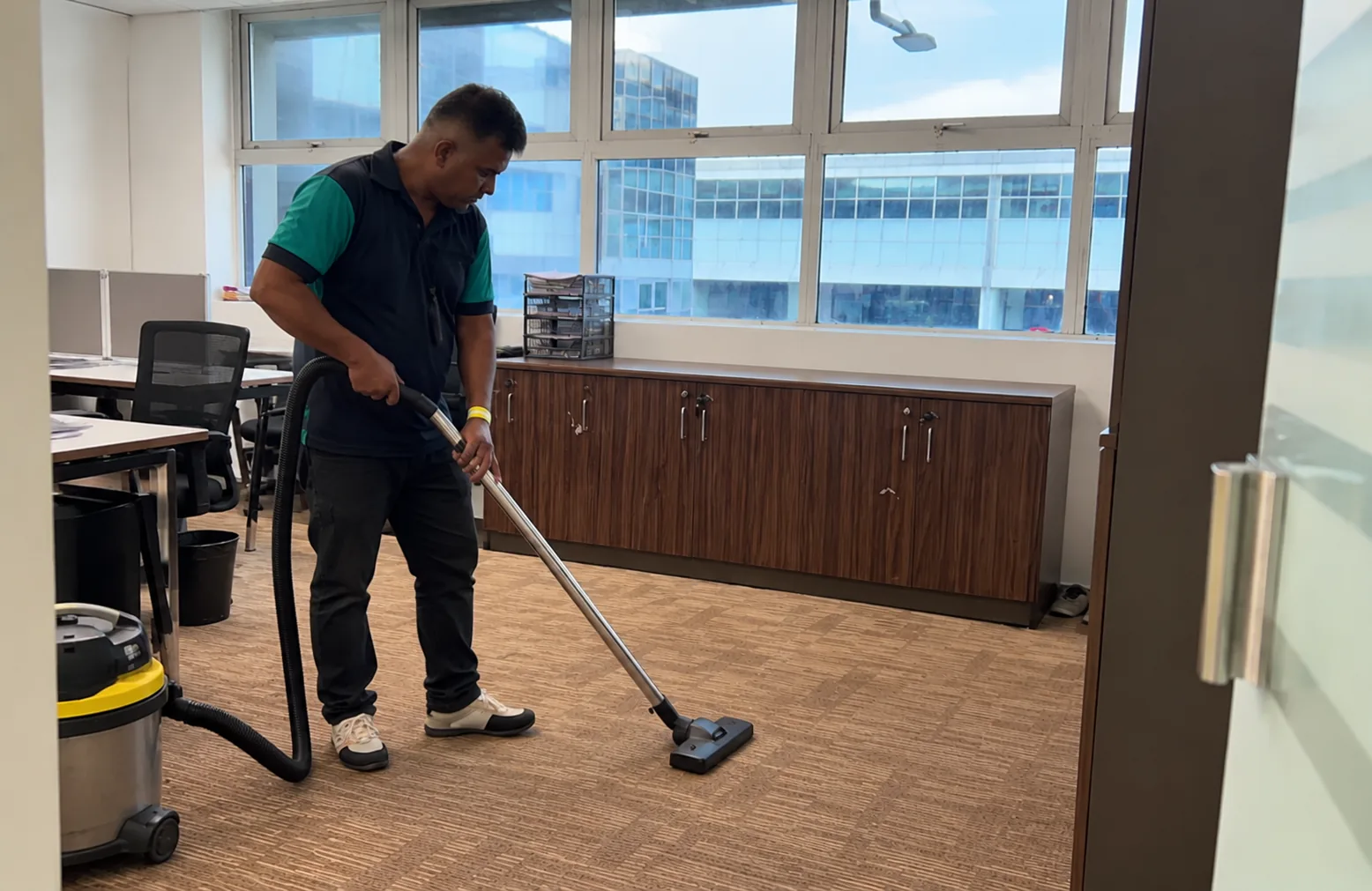 Office carpet vacuuming before low-moisture carpet cleaning